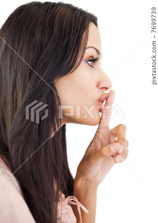 Woman making sign for quiet 7699739