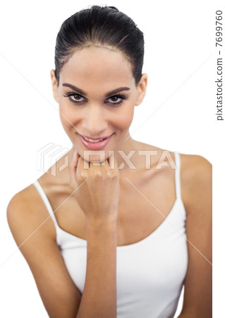 Beautiful brunette posing and looking at camera Beautiful brunette posing and looking at camera 7699760