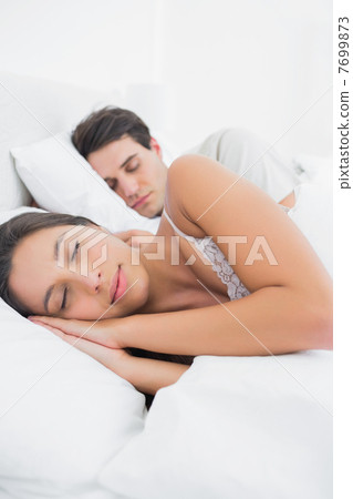 Woman sleeping next to her partner Woman sleeping next to her partner 7699873