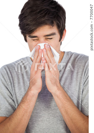 Man blowing his nose 7700047