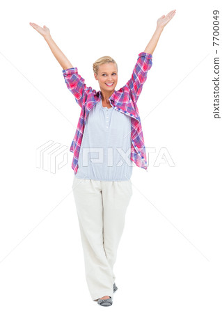 Blonde woman standing with hands up in air 7700049