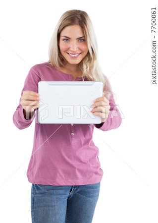 Smiling blonde woman holding tablet pc Smiling blonde woman holding tablet pc 7700061