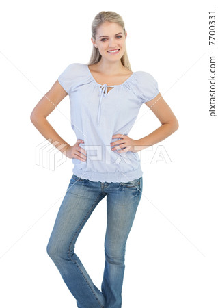 Blonde woman with hands on her hips 7700331