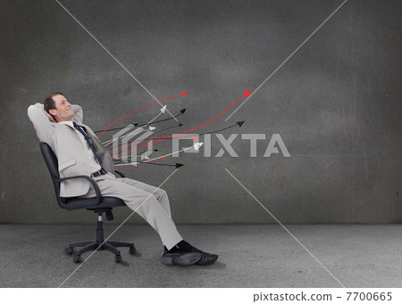 Attractive businessman relaxing on his chair Attractive businessman relaxing on his chair 7700665