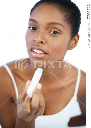 Woman holding her lip balm 7700712