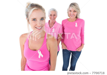 Three generations of women wearing pink tops and breast cancer r Three generations of women wearing pink tops and breast cancer r 7700718