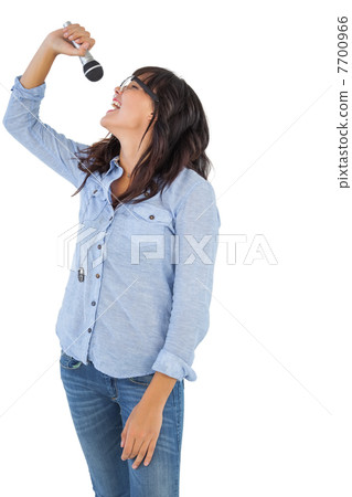 Brunette with her microphone singing Brunette with her microphone singing 7700966