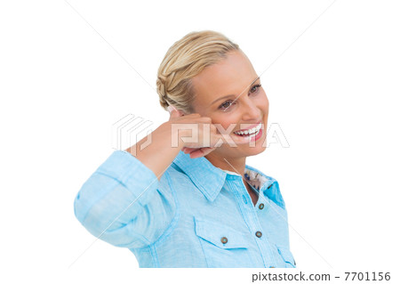 Attractive blonde doing a symbol of phone with her hand and look Attractive blonde doing a symbol of phone with her hand and look 7701156
