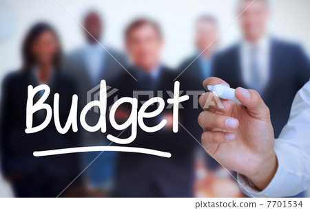 Businessman writing budget with a marker 7701534