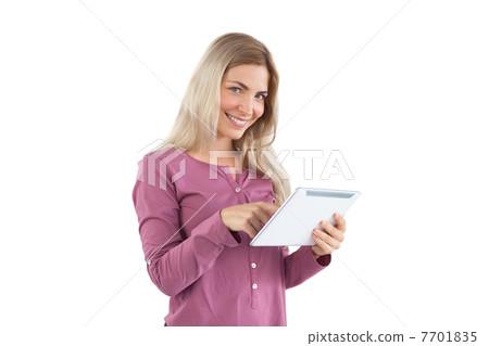 Smiling woman using tablet pc 7701835