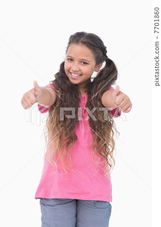 Little girl does thumbs up at camera 7701860