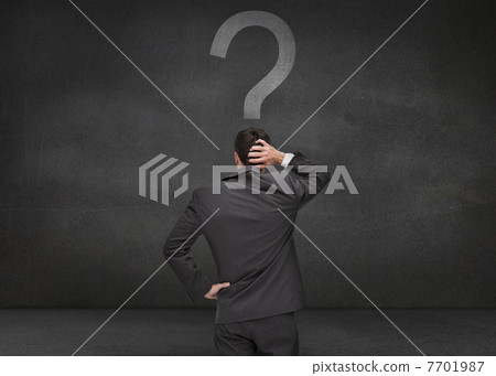 Rear view of a thoughtful businessman Rear view of a thoughtful businessman 7701987