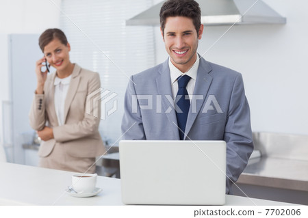 Businessman using a laptop in the morning 7702006