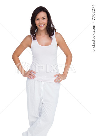 Smiling woman posing with hands on hip Smiling woman posing with hands on hip 7702274