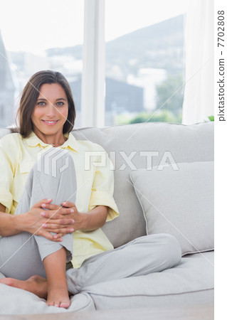 Portrait of a cheerful woman relaxing Portrait of a cheerful woman relaxing 7702808
