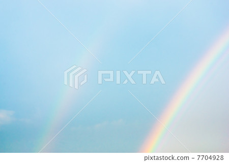 Double rainbow and blue sky 7704928