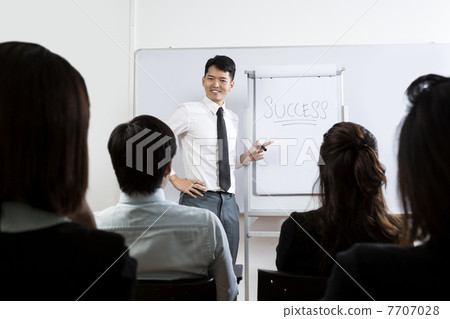 Chinese Business man giving presentation. Chinese Business man giving presentation. 7707028