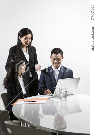 Asian business people having a meeting together Asian business people having a meeting together 7707193