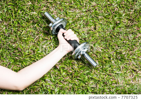 Chinese woman exercising with dumbbells. Chinese woman exercising with dumbbells. 7707325