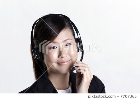 Happy female customer service representative Happy female customer service representative 7707365