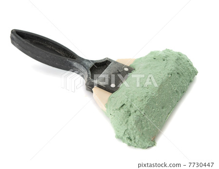 trowel with mortar isolated 7730447