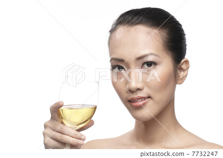 Beautiful Asian Woman with glass white wine Beautiful Asian Woman with glass white wine 7732247