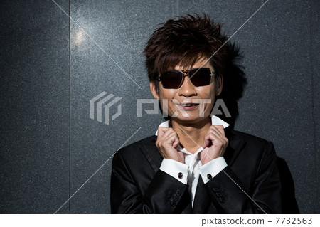 fashionable Asian man wearing stylish suit 7732563