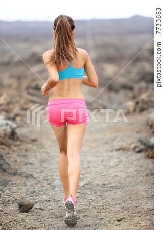 Trail runner woman running cross-country run 7733683