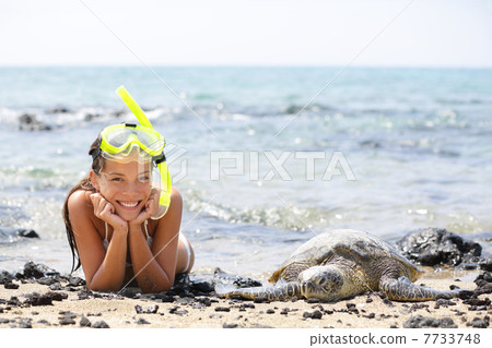 Hawaii girl swimming snorkeling with sea turtles 7733748