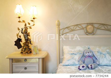 Toy hare on a bed Toy hare on a bed 7734244