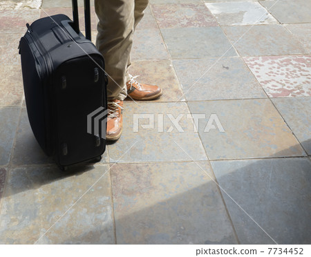 A suitcase and a man 7734452