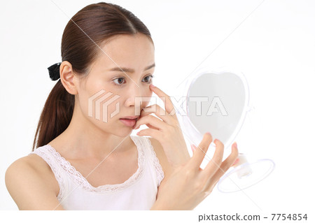 A young woman suffering from eye problems 7754854