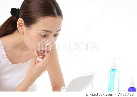 A young woman suffering from skin problems A young woman suffering from skin problems 7755752