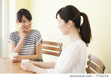 A woman who speaks at a cafe A woman who speaks at a cafe 7756254