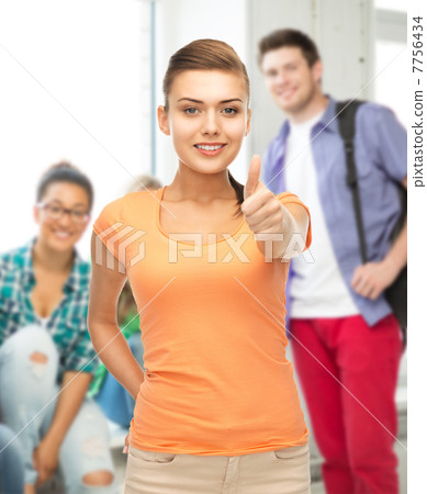 woman showing thumbs up at school 7756434