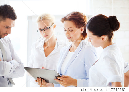 business team having discussion in office 7756581