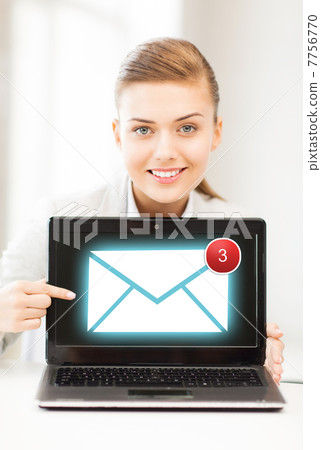 businesswoman with laptop in office 7756770