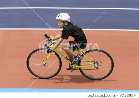 A girl running on a road racer A girl running on a road racer 7758994