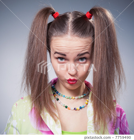 teen girl make faces with kiss looking at camera 7759490