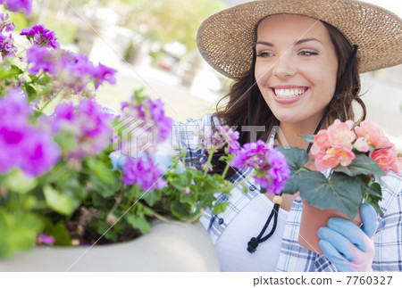 Young Adult Woman Wearing Hat Gardening Outdoors 7760327