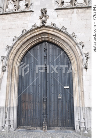 Bell tower gigantic door Bruges 7762945