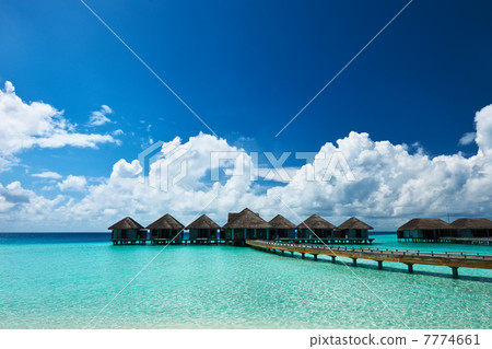 Beautiful beach with water bungalows 7774661