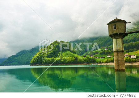 Beautiful emerald mountain lake in Switzerland 7774682