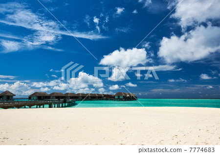 Beautiful beach with water bungalows 7774683