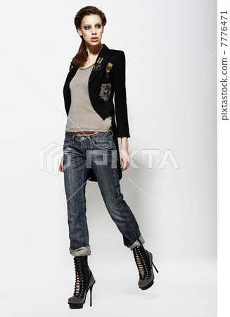 Fashionable Glamorous Woman in Jeans and High Boots. Vogue Style Fashionable Glamorous Woman in Jeans and High Boots. Vogue Style 7776471