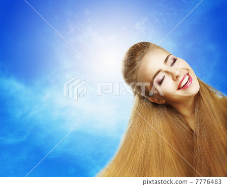 Positive Emotions. Portrait of Laughing Teen Girl over Sunny Blue Sky. Jubilance Positive Emotions. Portrait of Laughing Teen Girl over Sunny Blue Sky. Jubilance 7776483