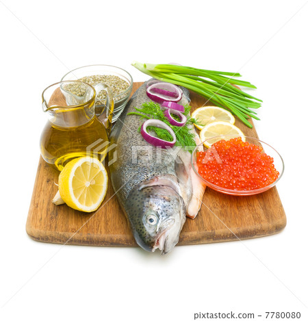 fresh raw trout and caviar on a cutting board. white background. 7780080