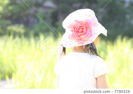 A girl in the back of a meadow A girl in the back of a meadow 7780326