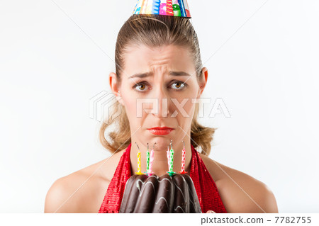 Woman celebrating birthday with cake candles wiped Woman celebrating birthday with cake candles wiped 7782755