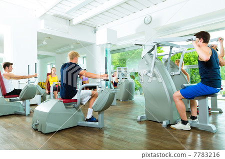 People in sport gym on machines 7783216